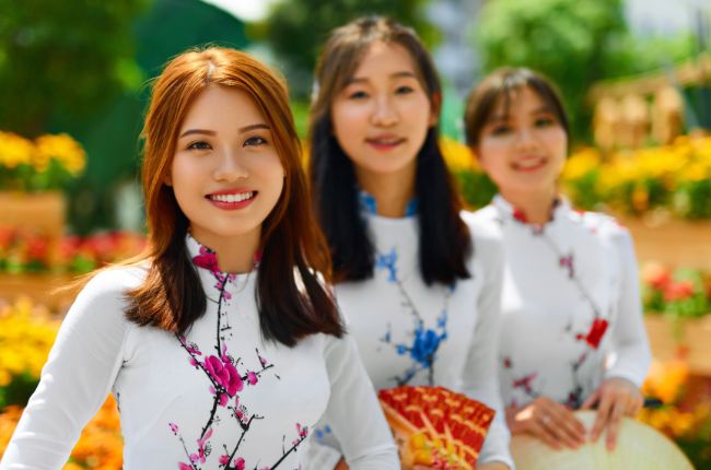 Women in traditional Ao Dai Dresses