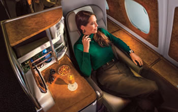 Lady sitting in business class on flight