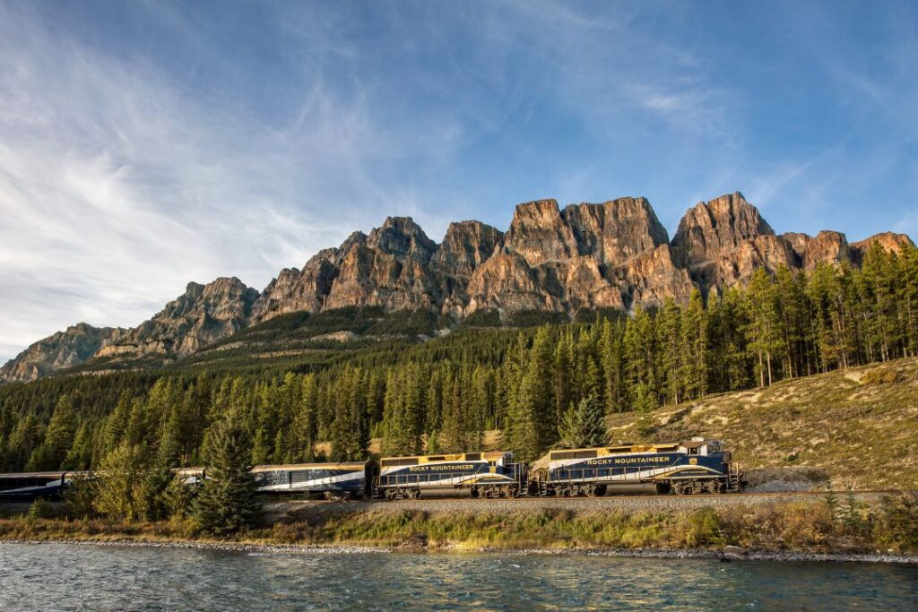 Rocky Mountaineer, with mountains in the background and river in the foreground