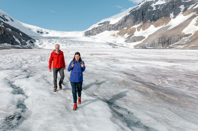 couple walking on the icefields